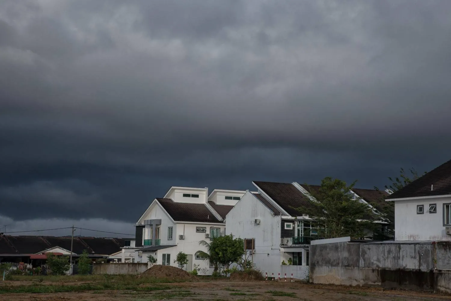 Storm clouds over a neighborhood